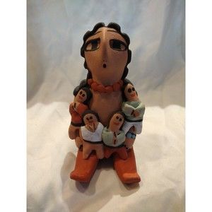 Navajo Storyteller signed by artistist E plummer i5 inches tall